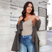 Woman wearing a Stone Basic Camisole with and Army green French Terry Jacket over it.