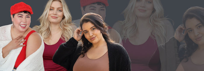 Woman outside wearing chunky cardigan and cranberry camisole