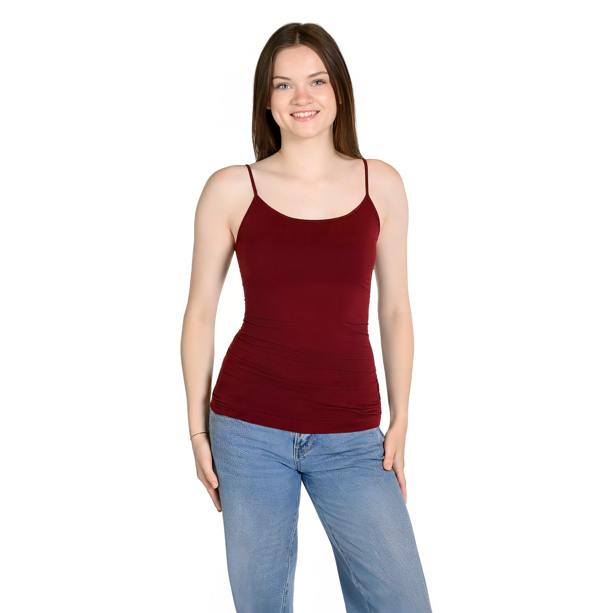 A woman modeling a sleeveless, scoop-neck camisole in cranberry, paired with light-wash blue jeans, against a plain white background.