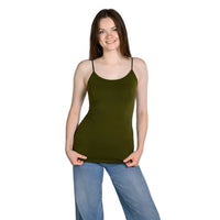 A woman modeling a olive green spaghetti-strap tank top paired with blue jeans, standing against a plain white background.