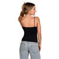 A woman shown from the back wearing a black spaghetti-strap petite camisole top and light-wash jeans against a plain white studio background.