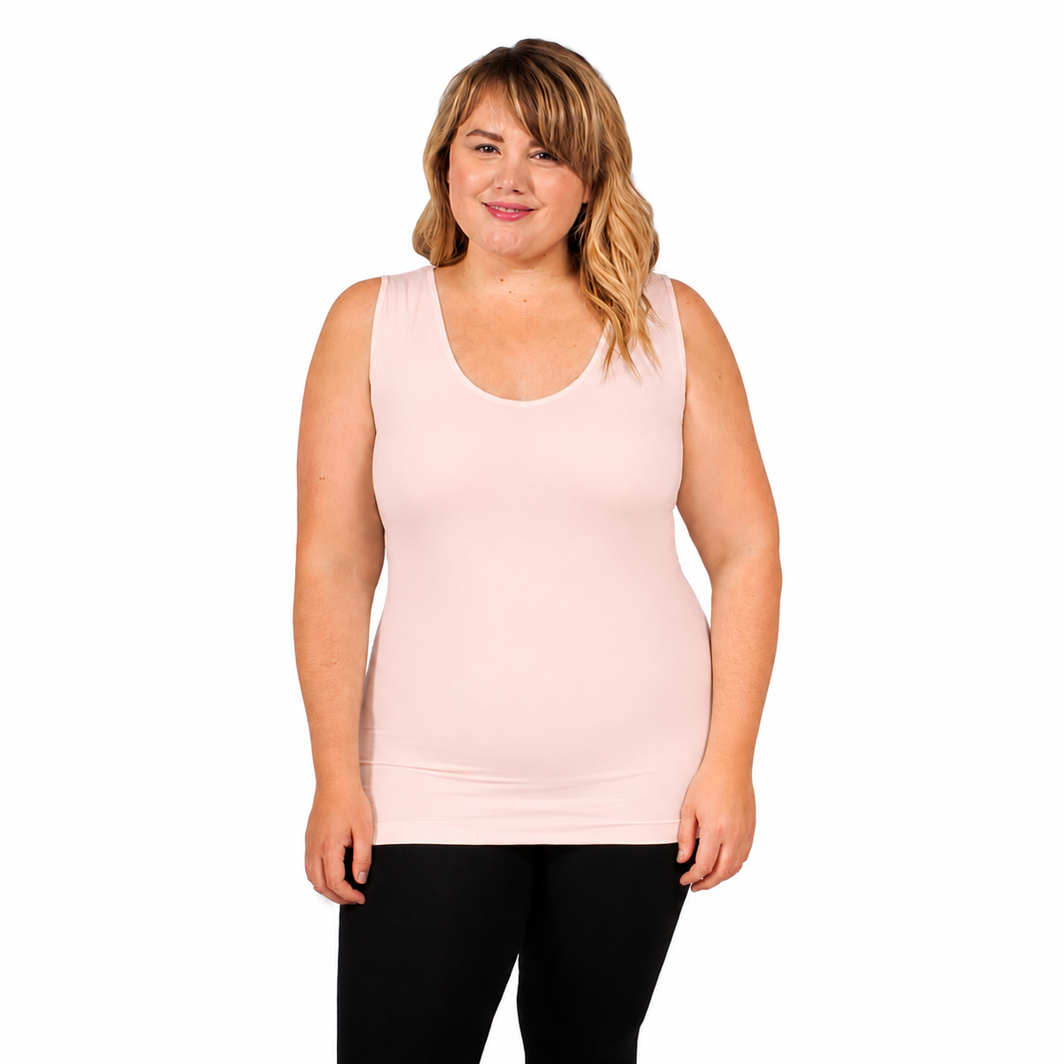 front view of woman wearing v neck full coverge tank top in baby pink