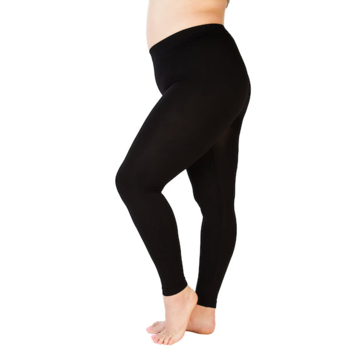 Black plus size leggings with the knee popped