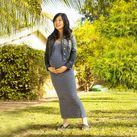 Pregnant Woman Outside Wearing A Jean Jacket And Denim Striped Maxi Dress