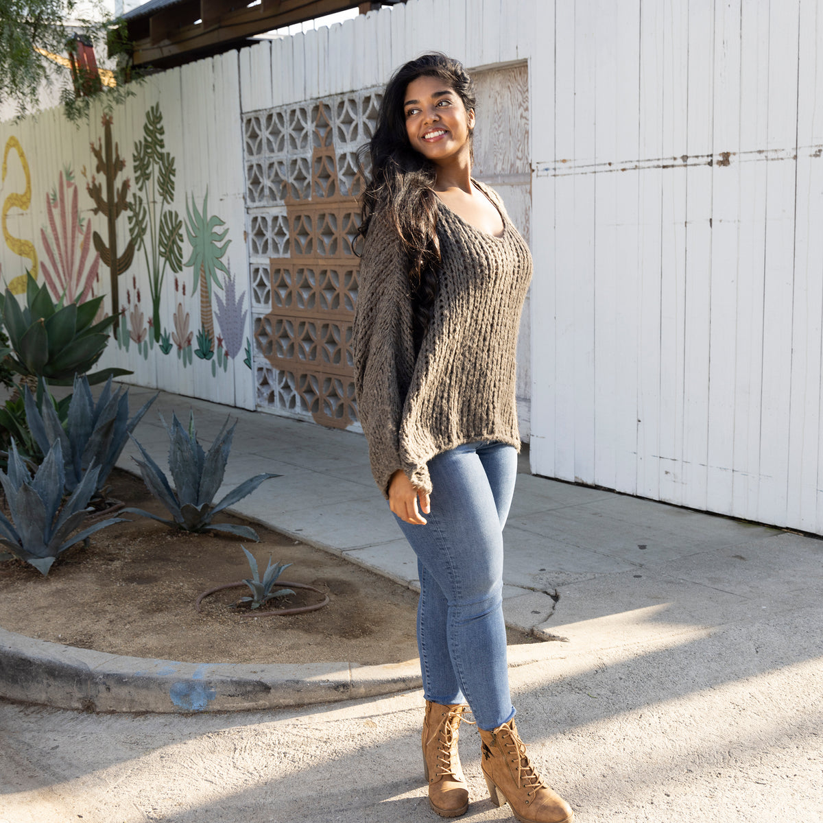 Mushroom V Neck Knit Sweater Girl Outside Wearing Denim and Boots