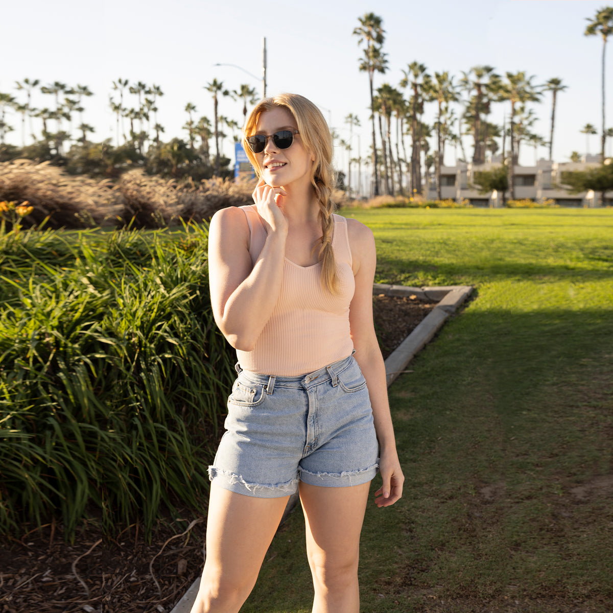 Blossom Soft Ribbed V Neck Tank Top Girl Outside with Braid and Jean Shorts